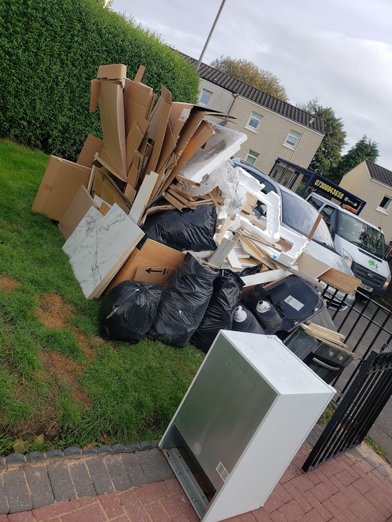 Klearway Junk van being loaded with unwanted furniture